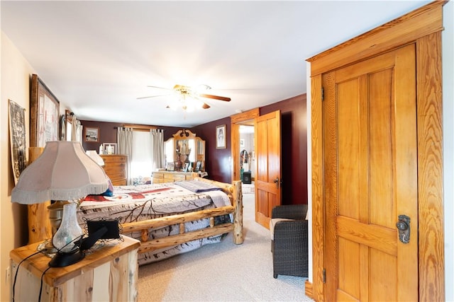 bedroom with ceiling fan and light carpet