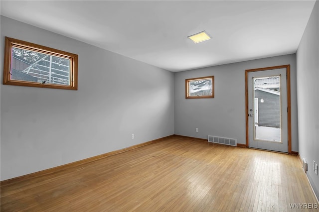 unfurnished room featuring light wood-type flooring