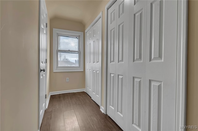 hallway featuring dark wood-type flooring