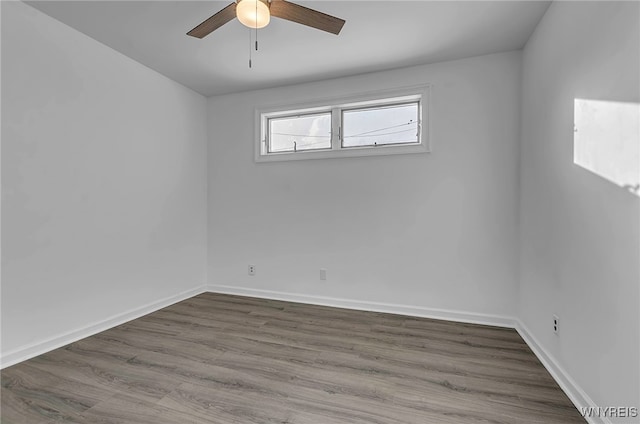 unfurnished room with wood-type flooring and ceiling fan