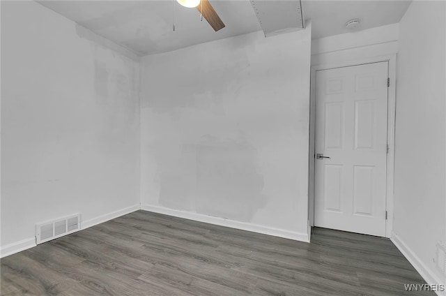 unfurnished room with ceiling fan and dark hardwood / wood-style flooring