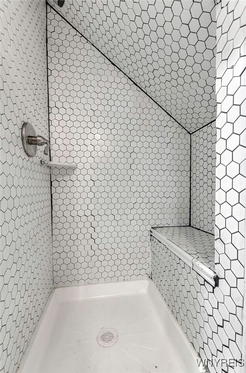 bathroom with tiled shower