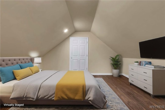 bedroom with dark hardwood / wood-style flooring and lofted ceiling