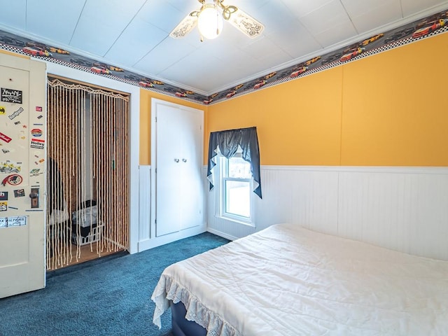 carpeted bedroom with crown molding