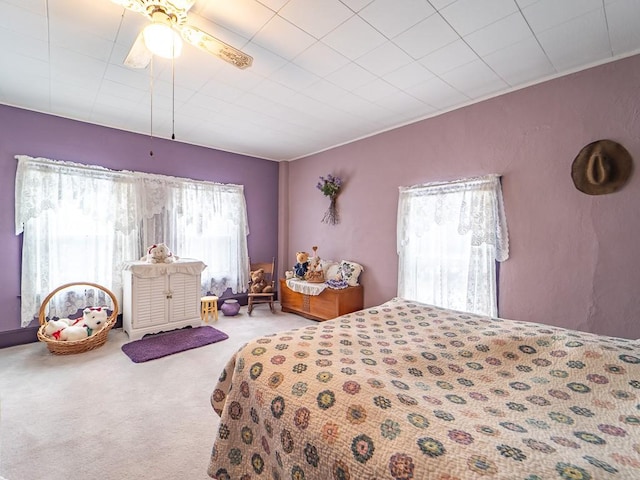 carpeted bedroom with ceiling fan