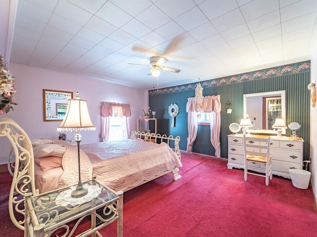 bedroom with ceiling fan, carpet flooring, and multiple windows