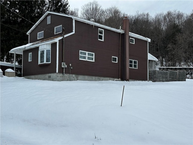 view of snow covered property