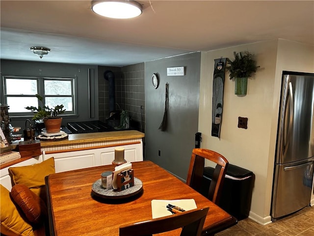 dining area with a wood stove