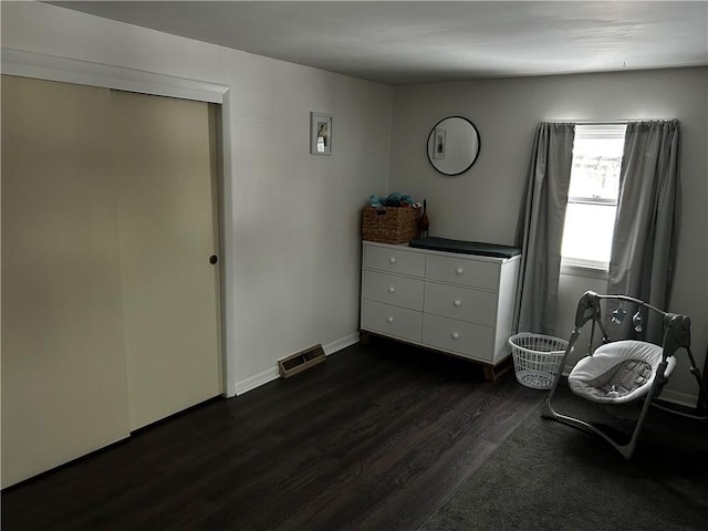 unfurnished room with dark wood-type flooring