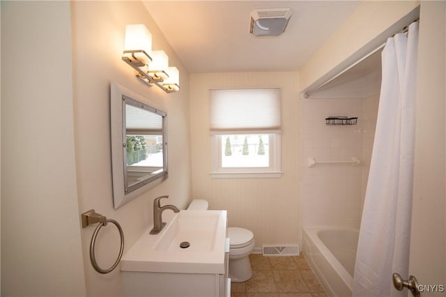 full bathroom featuring shower / bath combination with curtain, tile patterned floors, toilet, and vanity