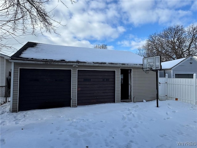 view of snow covered garage