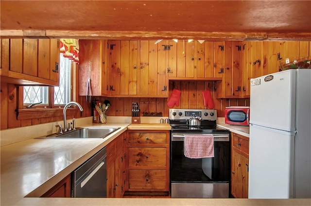 kitchen with sink and appliances with stainless steel finishes