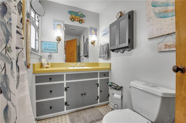 bathroom with vanity and toilet