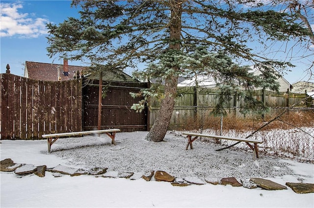 view of yard layered in snow