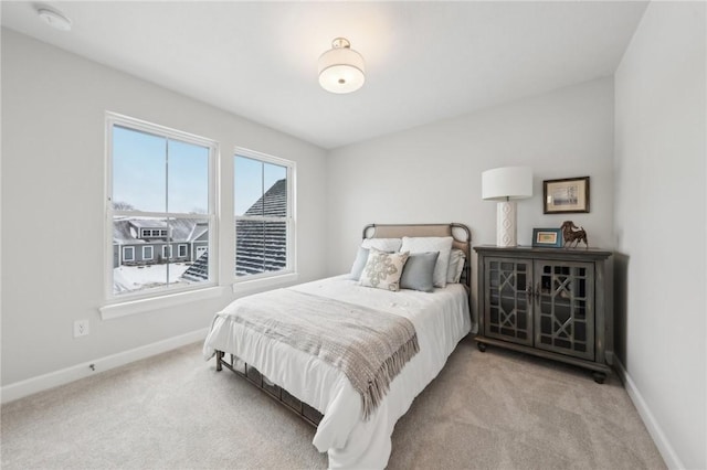 bedroom with light colored carpet