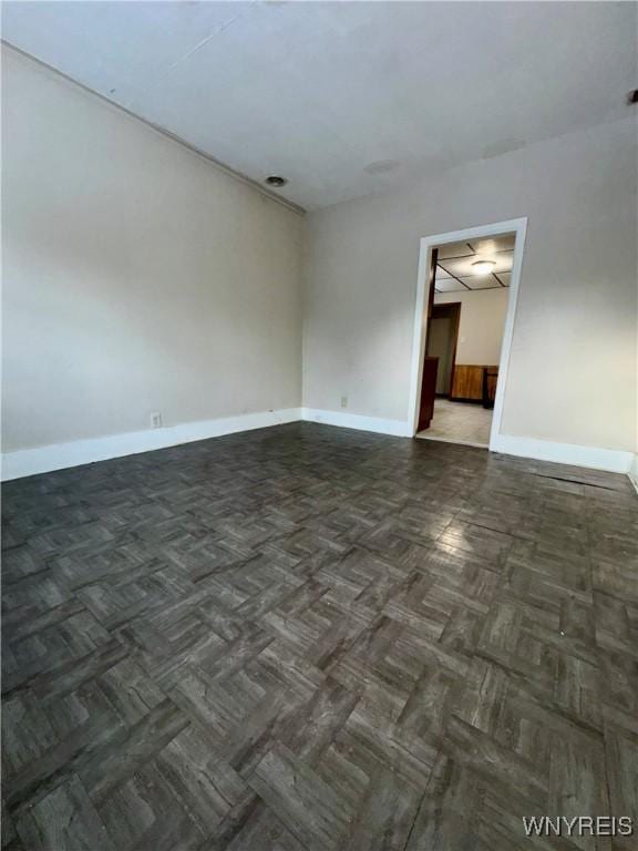 empty room featuring dark parquet floors