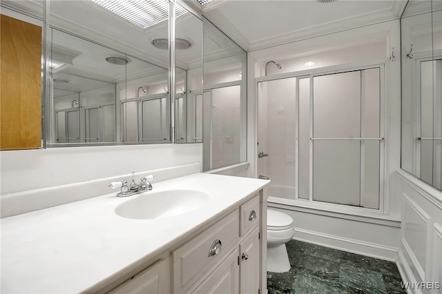 full bathroom featuring bath / shower combo with glass door, vanity, toilet, and crown molding