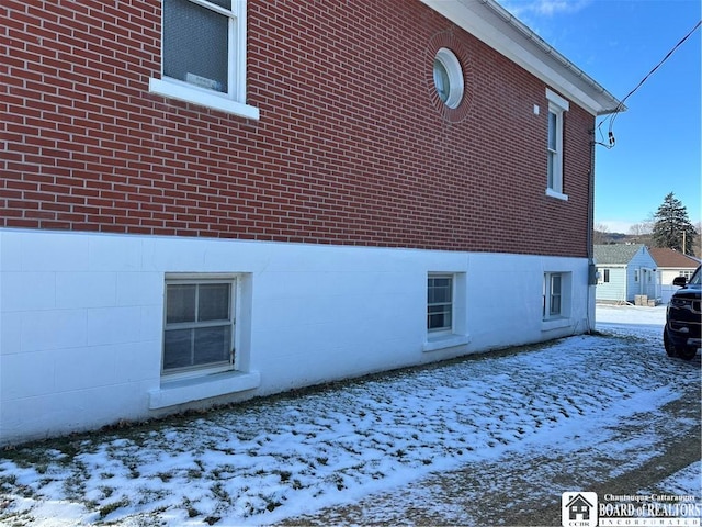 view of snow covered property