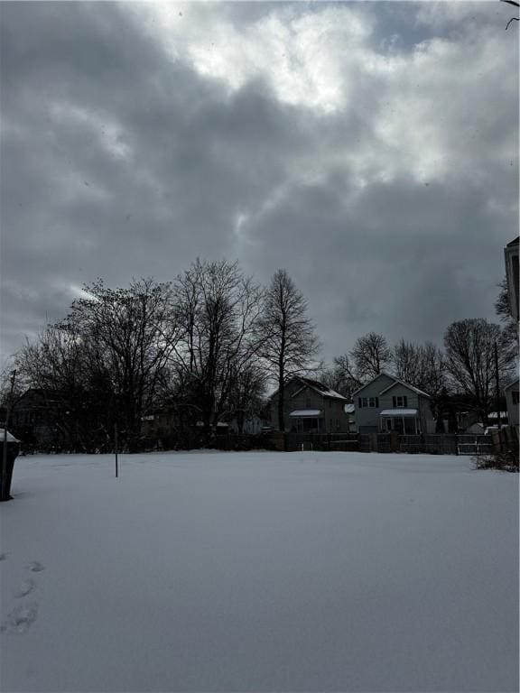 view of yard layered in snow