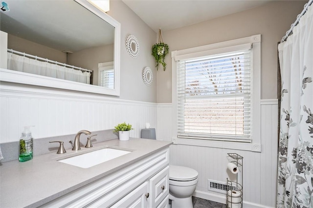 bathroom with vanity and toilet