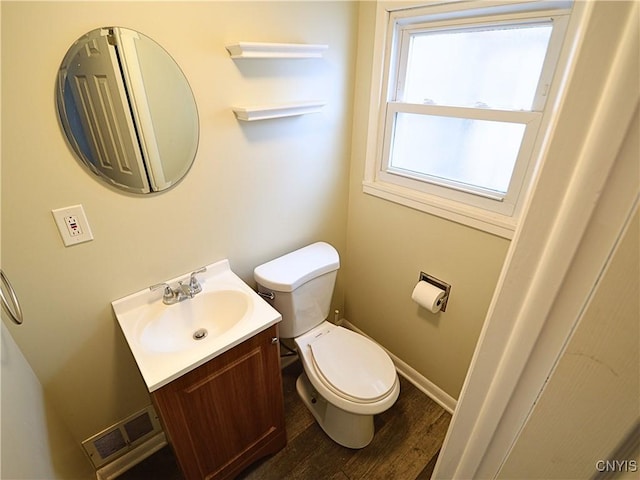 bathroom with vanity, hardwood / wood-style floors, and toilet