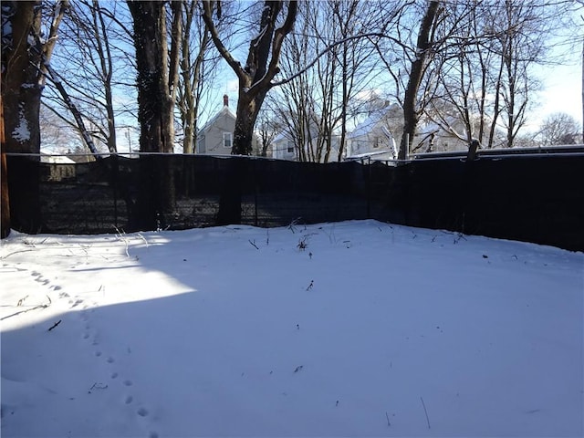 view of yard layered in snow