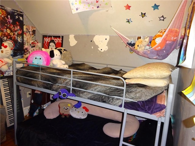 bedroom featuring lofted ceiling