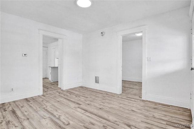 unfurnished room featuring light wood-type flooring