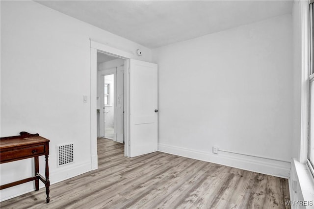 unfurnished room featuring light hardwood / wood-style flooring