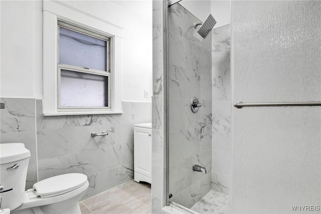 bathroom with tiled shower and toilet