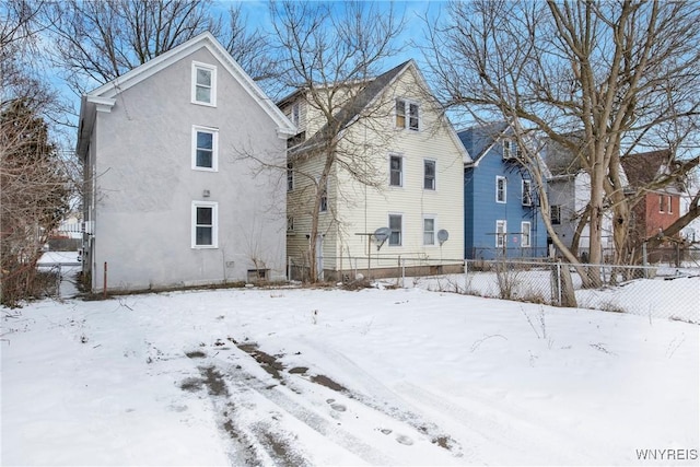 view of snow covered property