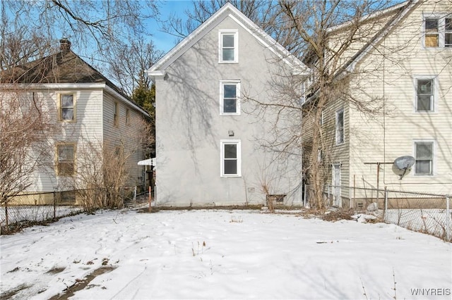 view of snow covered house