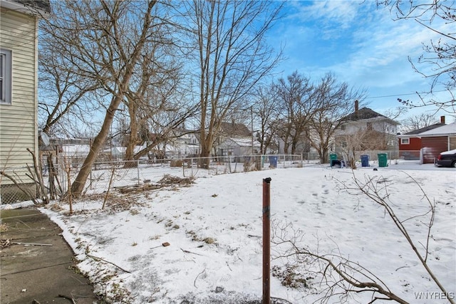 view of yard layered in snow