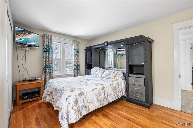 bedroom with hardwood / wood-style flooring