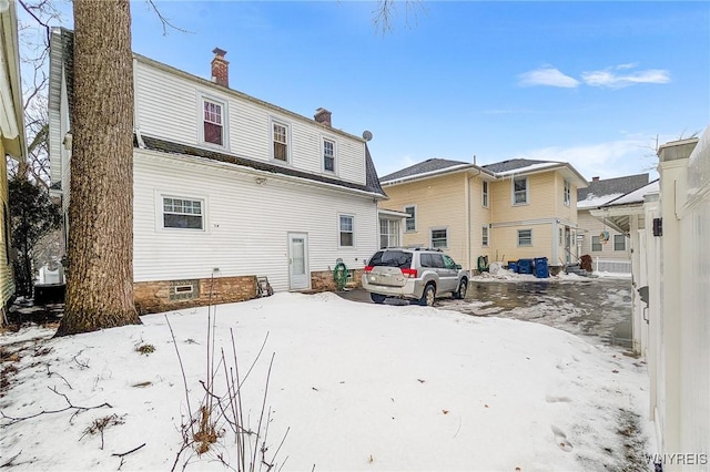 view of snow covered property