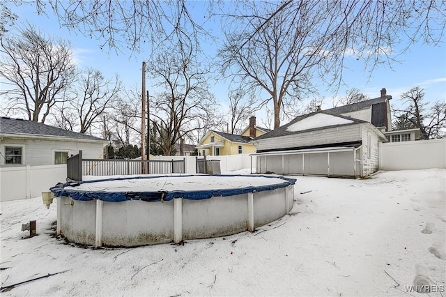 view of snow covered pool