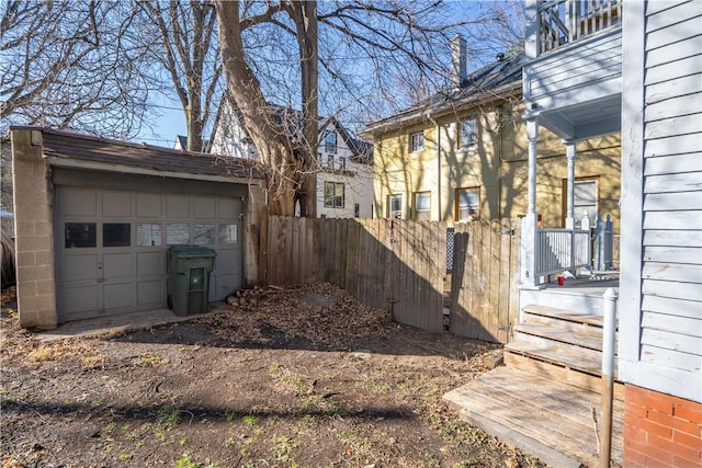 view of yard with a garage and an outdoor structure