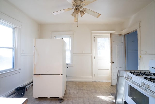 kitchen with ceiling fan and white appliances