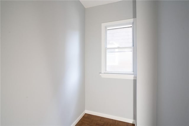 empty room featuring dark parquet floors