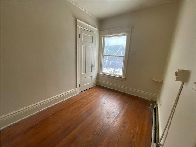 spare room with dark wood-type flooring