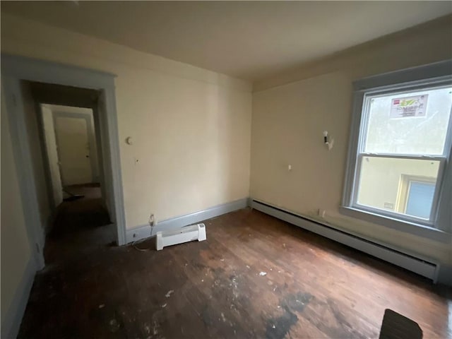 unfurnished room with a baseboard radiator