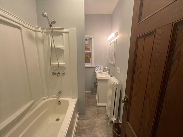 bathroom with vanity, radiator, and shower / bathing tub combination