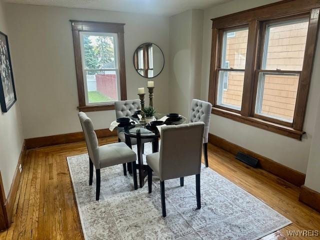 dining area with light wood-type flooring