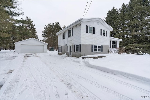 view of front of house featuring a garage and an outdoor structure