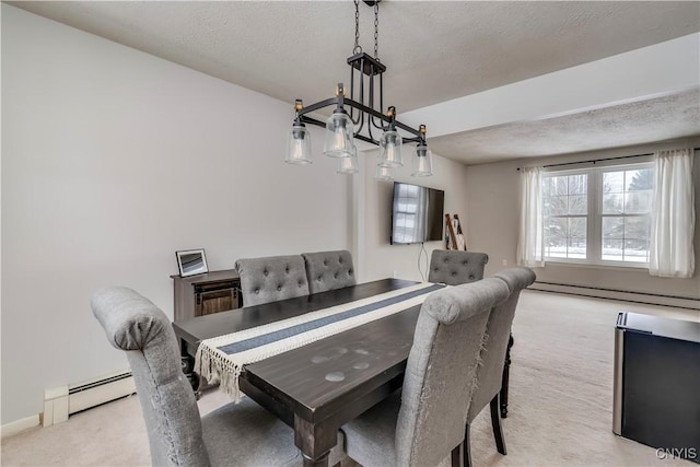 dining area with a baseboard radiator, light colored carpet, and a textured ceiling