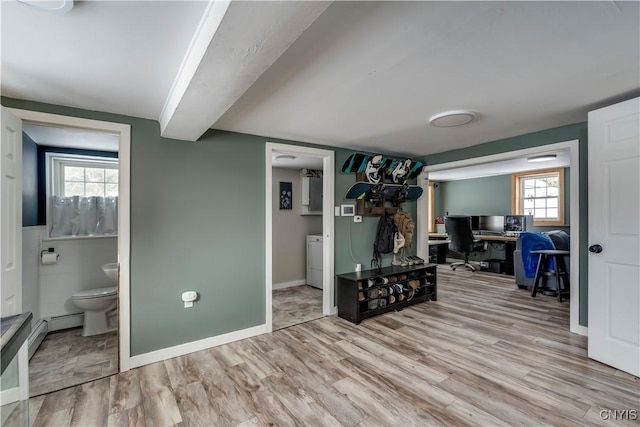 interior space featuring washer / dryer and light hardwood / wood-style flooring