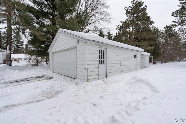 view of snow covered garage