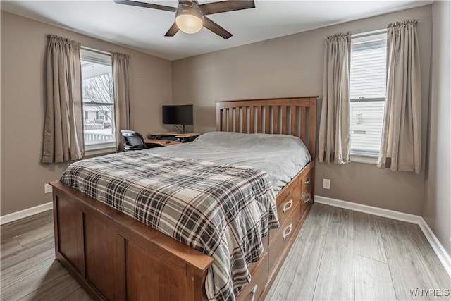 bedroom featuring hardwood / wood-style flooring and ceiling fan