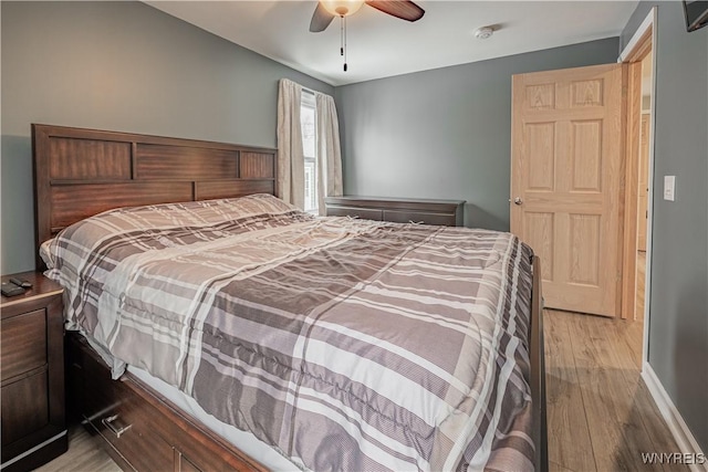 bedroom with ceiling fan and light hardwood / wood-style flooring