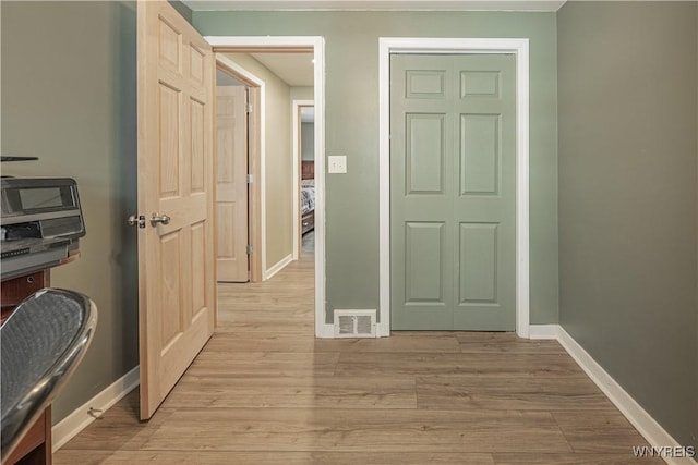 hall featuring light hardwood / wood-style floors